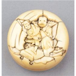 An ivory manju of sarumawashi.