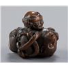 Image 1 : A wood netsuke of an octopus and a monkey.
