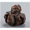 Image 5 : A wood netsuke of an octopus and a monkey.