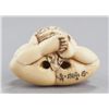 Image 5 : An ivory netsuke of a boy with a mask.