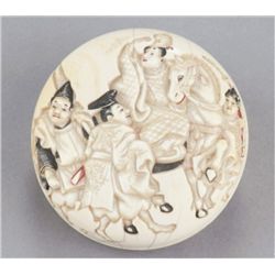 An ivory manju of a nobleman on horseback.