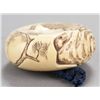 Image 3 : An ivory manju of a tiger on a rock.