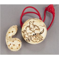 A group of two carved ivory netsuke.