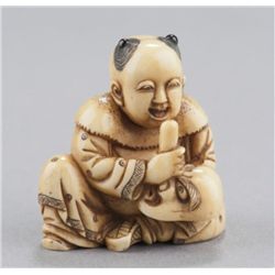 An ivory shunga netsuke of a karako.