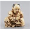 Image 1 : An ivory shunga netsuke of a karako.