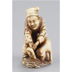 An ivory netsuke of Hanasaka Jiji raking gold coin