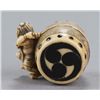 Image 10 : A group of three netsuke of various material.