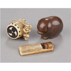 A group of three netsuke of various material.