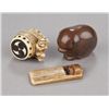 Image 1 : A group of three netsuke of various material.