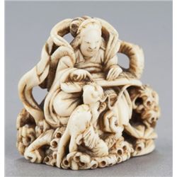 An ivory netsuke of Benten with dragon