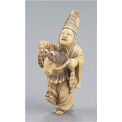 A ivory netsuke of a Sambaso dancer.