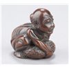 Image 2 : A wood netsuke of a blind man lifting scrotum.