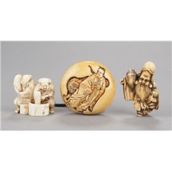 A group of three ivory netsuke.