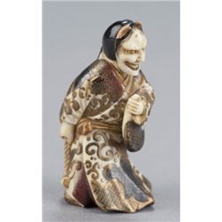 A ivory and lacquer netsuke of Kiyohime.