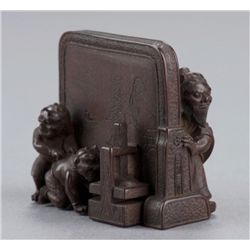 A wood netsuke of Shoki and Oni.