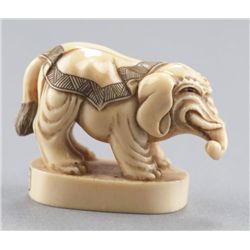 A ivory netsuke of an elephant.