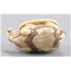 Image 8 : A ivory netsuke of an elephant.