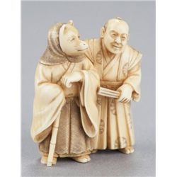 An ivory netsuke of the fox priest and village hea