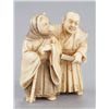 Image 1 : An ivory netsuke of the fox priest and village hea