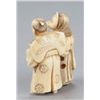 Image 3 : An ivory netsuke of the fox priest and village hea