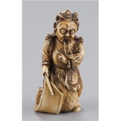 An ivory netsuke of a Noh-Gigaku of a figure of Ry