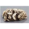 Image 3 : An ivory netsuke of a toad with insects.
