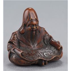 A wood netsuke of Jurojin.