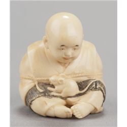 An ivory netsuke of Sesshu being untied by rat.