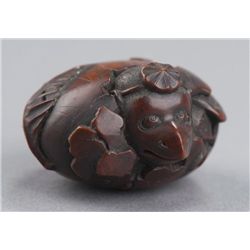 A wood netsuke of a Tengu no Tamago hatching.