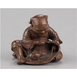 A wood netsuke of Daikoku and bag of rats