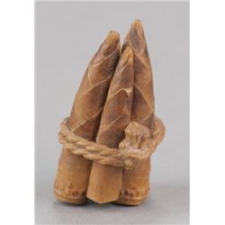 A wood netsuke of 5 bamboo shoots.