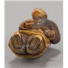 Image 5 : An ivory netsuke of a Chinese man.