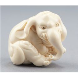 An ivory netsuke of an elephant.