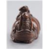 Image 10 : A wood netsuke of a baku and monkey.