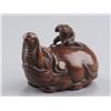 Image 5 : A wood netsuke of a baku and monkey.