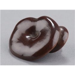 A wood netsuke of mushrooms.