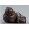 Image 1 : A wood netsuke of a Shojo sleeping.