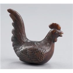 A wood netsuke of a cock.