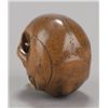 Image 3 : A wood netsuke of a skull with ivory teeth.