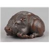 Image 1 : A fine wood netsuke of a reclining boar.