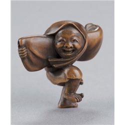 A wood netsuke of townsman as a butterfly dancer.