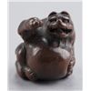 Image 1 : A wood netsuke of a tanuki.