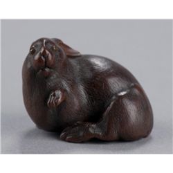 A wood netsuke of a rabbit.