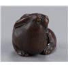 Image 2 : A wood netsuke of a rabbit.