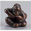 Image 1 : A wood netsuke of a monkey.