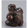 Image 4 : A wood netsuke of a monkey.