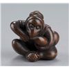 Image 6 : A wood netsuke of a monkey.
