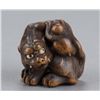 Image 1 : A boxwood netsuke of a tiger and monkey.