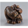Image 2 : A boxwood netsuke of a tiger and monkey.