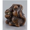 Image 5 : A boxwood netsuke of a tiger and monkey.